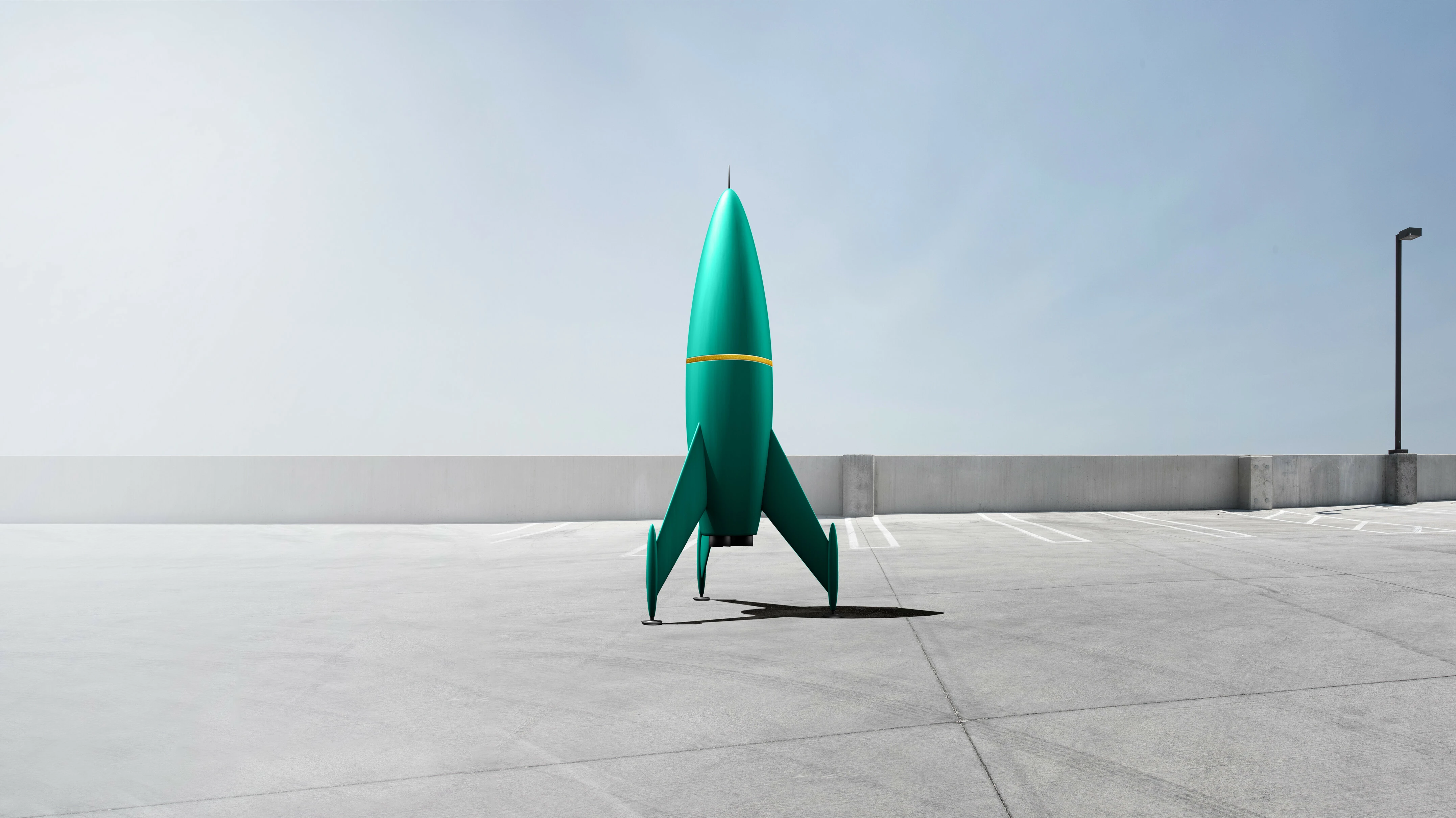 A green Rocket standing on a park deck ready for launch