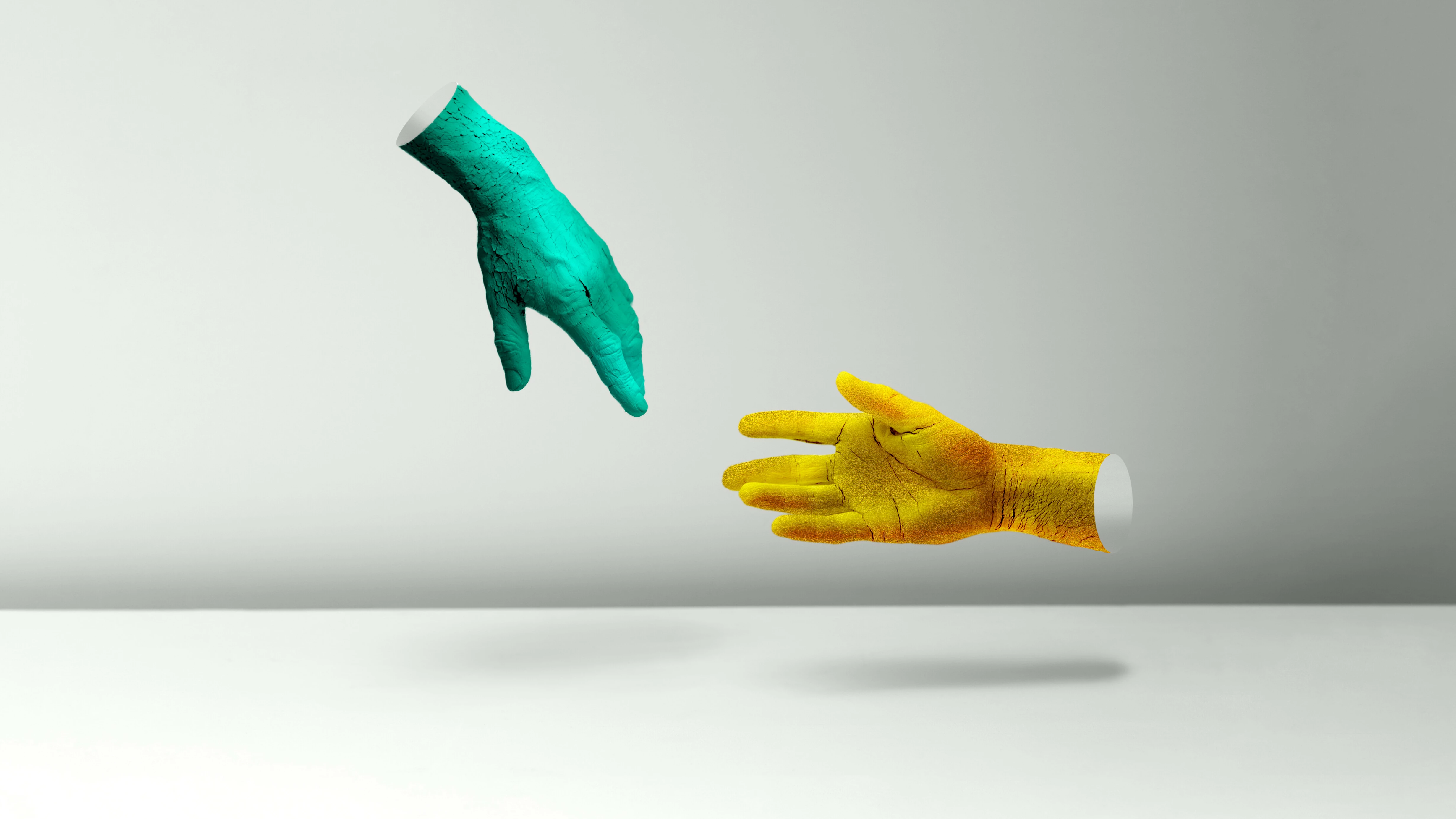 two hands reaching each other